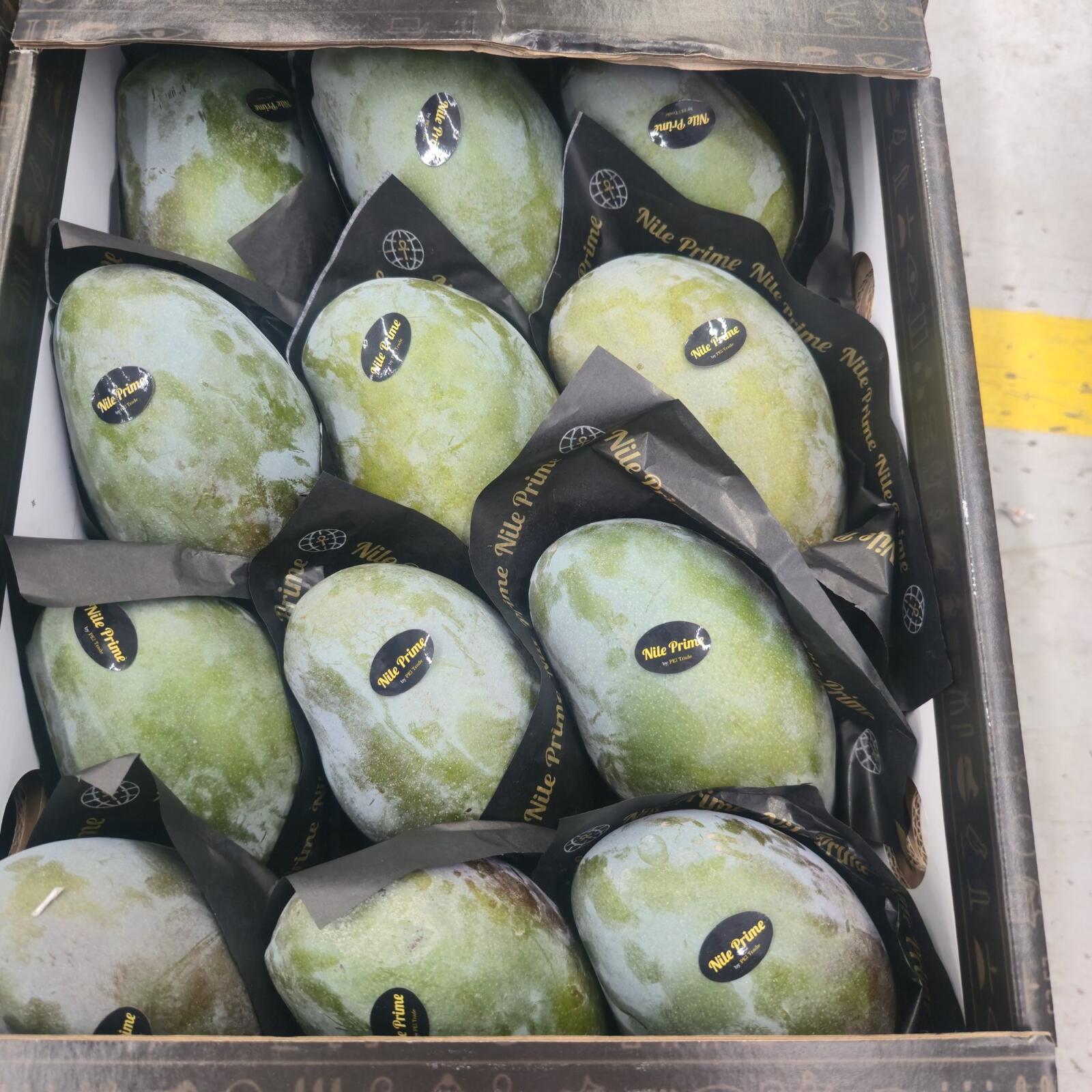 Nile Prime sleeves and stickers on Egyptian mangoes packed in the export carton