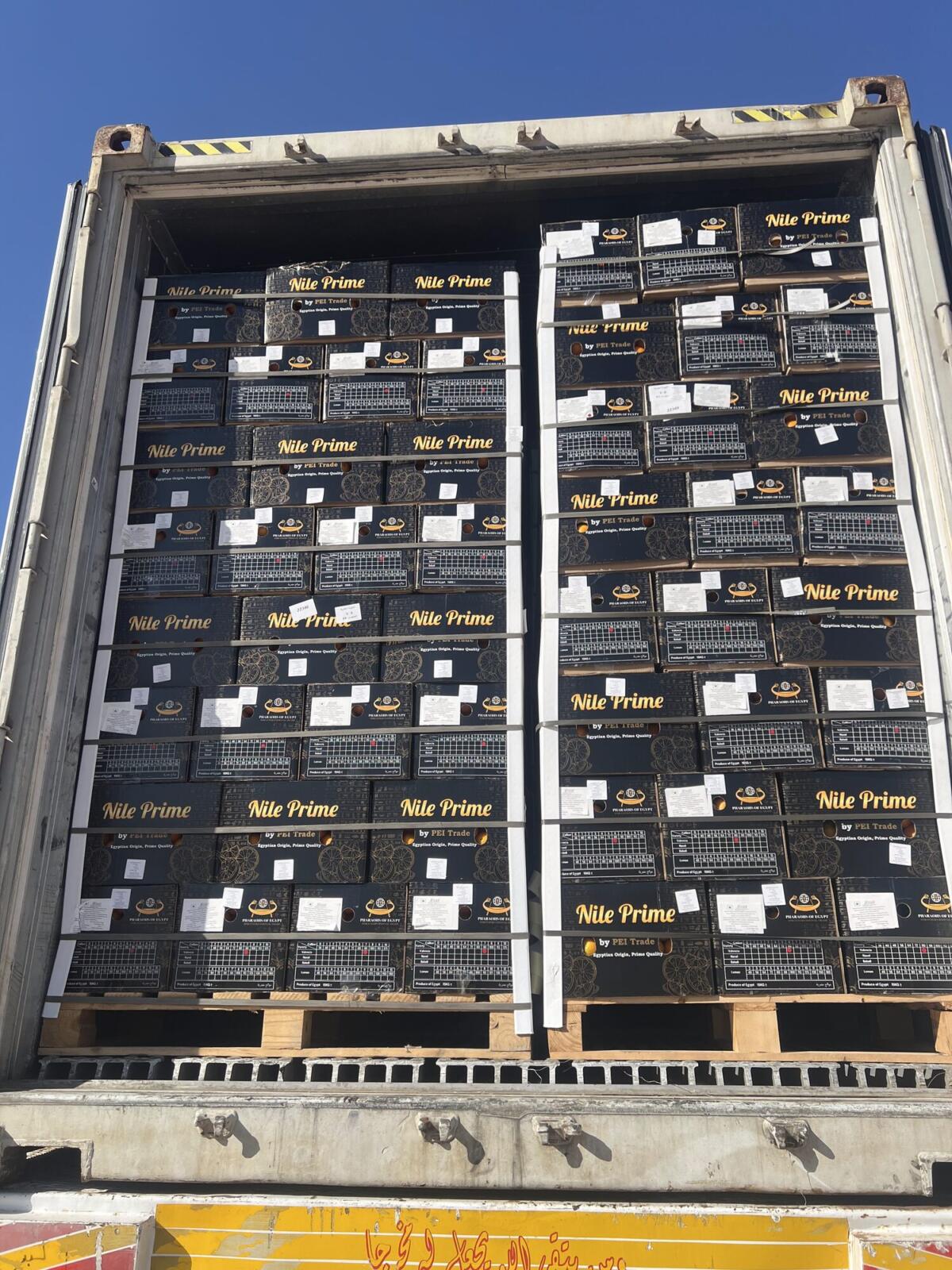 Loaded orange export container ready for sealing at dispatch